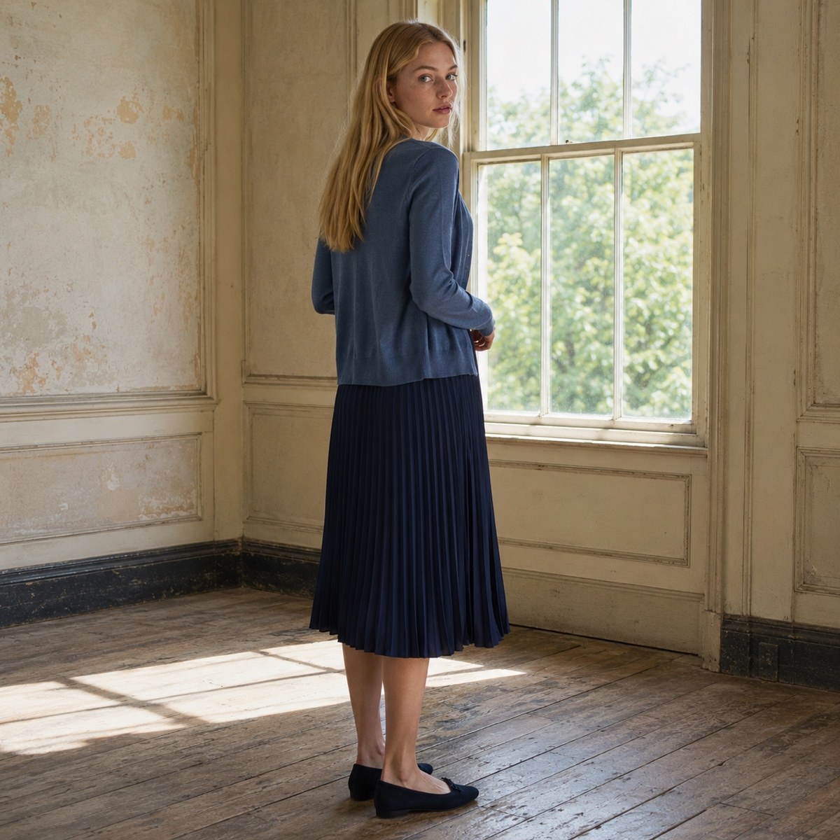 Shortlands sunray-pleat midi dress — Pleated Midi Dresses by ORASCI. worn by a model, side view.