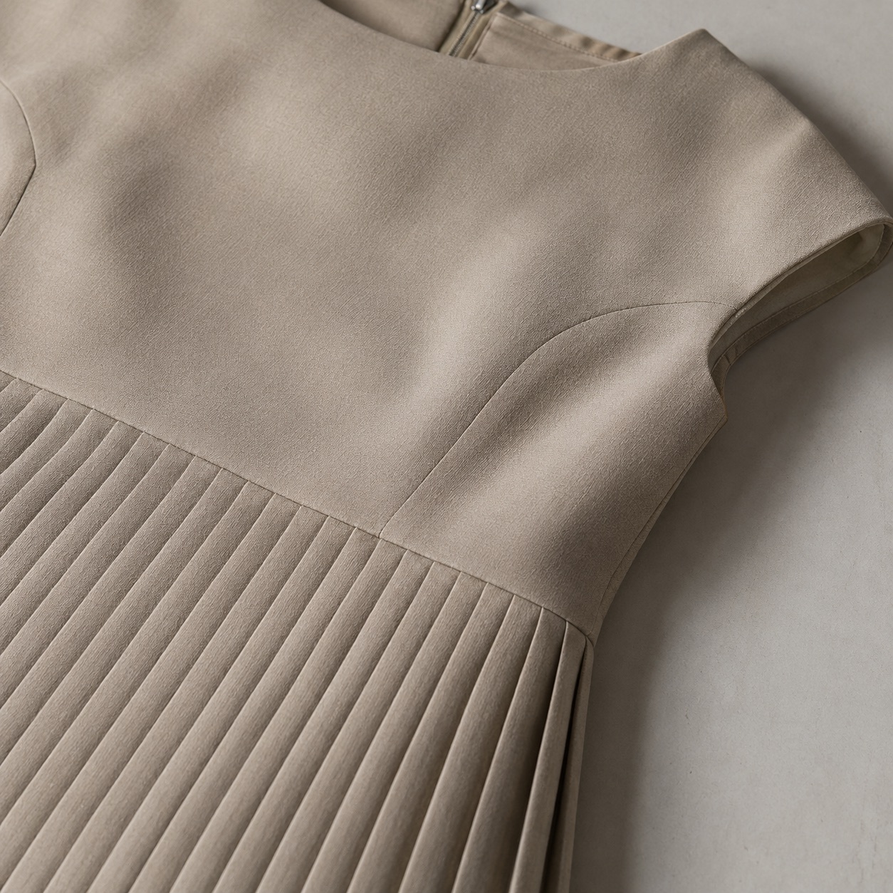 Alder Lane knife-pleat midi dress — Pleated Midi Dresses by ORASCI. close detail of the fabric and finish.