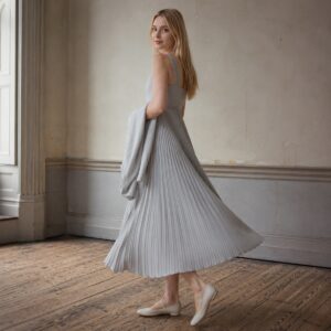 Keston sunray-pleat midi dress — Pleated Midi Dresses by ORASCI. worn by a model.