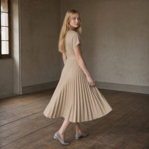 Petts Wood knife-pleat midi dress — Pleated Midi Dresses by ORASCI. worn by a model.