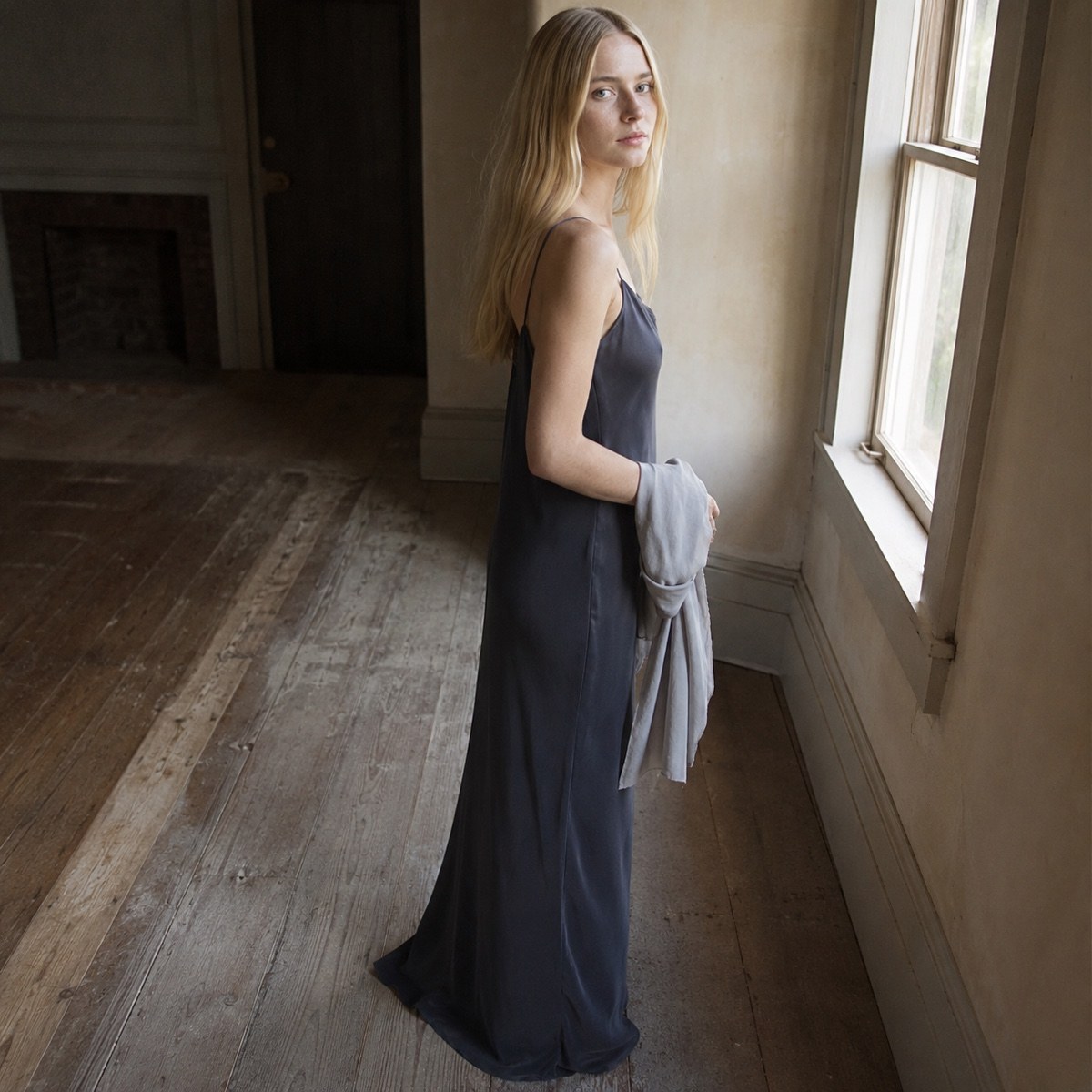 Sorrel Field bias-cut slip maxi dress — Slip Maxi Dresses by ORASCI. worn by a model, side view.